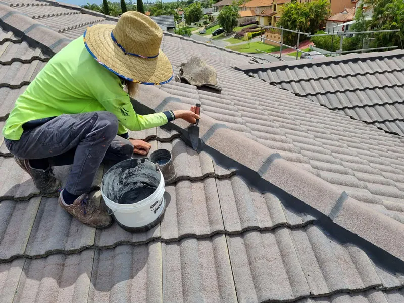 Nova Roof Repairs roofer repairing a tile roof on a Melbourne home